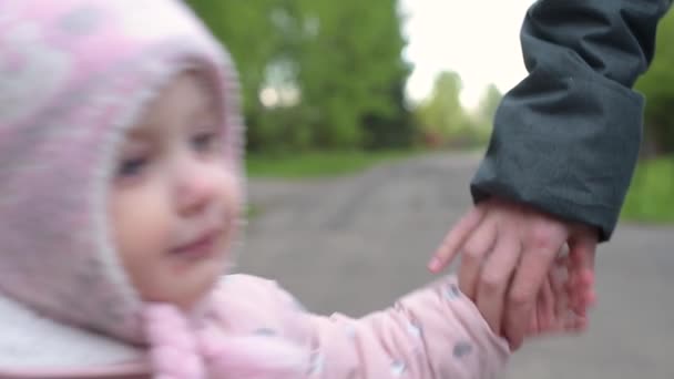 Mom Takes Her Daughter Hand Walk Path Hands Close — Stock Video