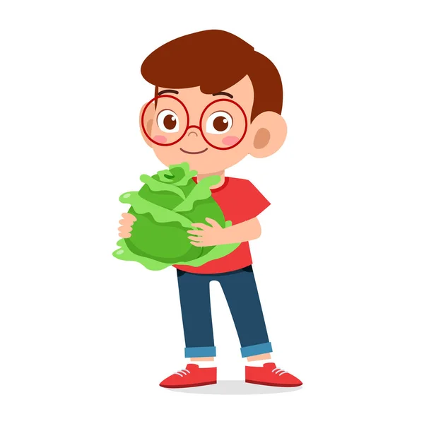 Šťastný roztomilý kluk drží čerstvou zeleninu — Stock fotografie