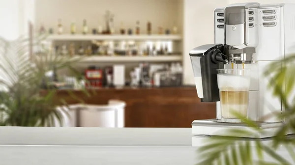 Blurred  bright kitchen interior with coffee machine.