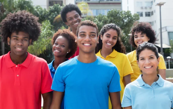 Large group of attractive multiethnic young adults — Stock Photo, Image