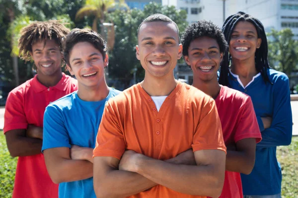Group of five young men with crossed arms — Stock Photo, Image