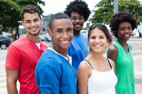 Multiethnic hipster group walking to the city