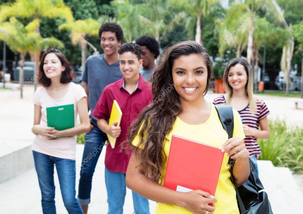 Latin american female student with group of international studen