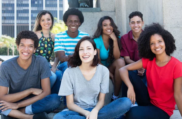 Large group of happy multiethnic young men and women — Stock Photo, Image