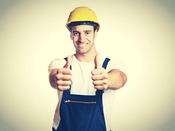 Trabalhador da construção latina feliz mostrando ambos os polegares em r vintage — Fotografia de Stock