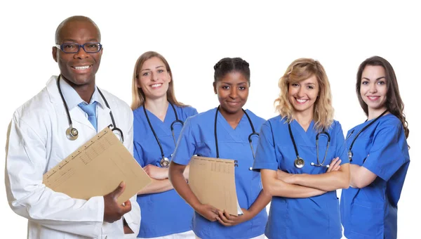 Handsome african american doctor with group of international nur — Stock Photo, Image