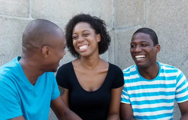 Conversation of three african men and woman — Stock Photo, Image