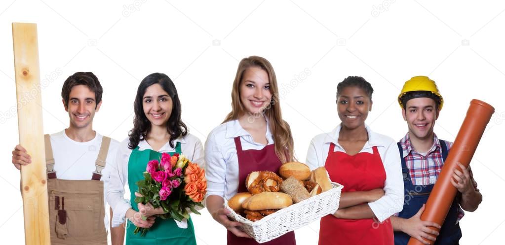 Beautiful caucasian female baker with group of other internation
