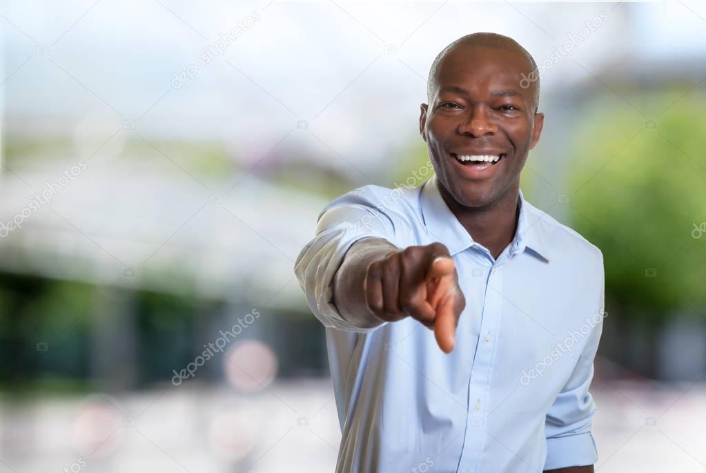 Pointing african american businessman