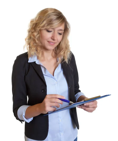 Secretary with blue blazer and clipboard writing note — Stock Photo, Image