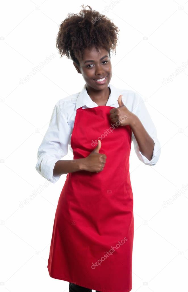 African american waitress with red apron has fun at work