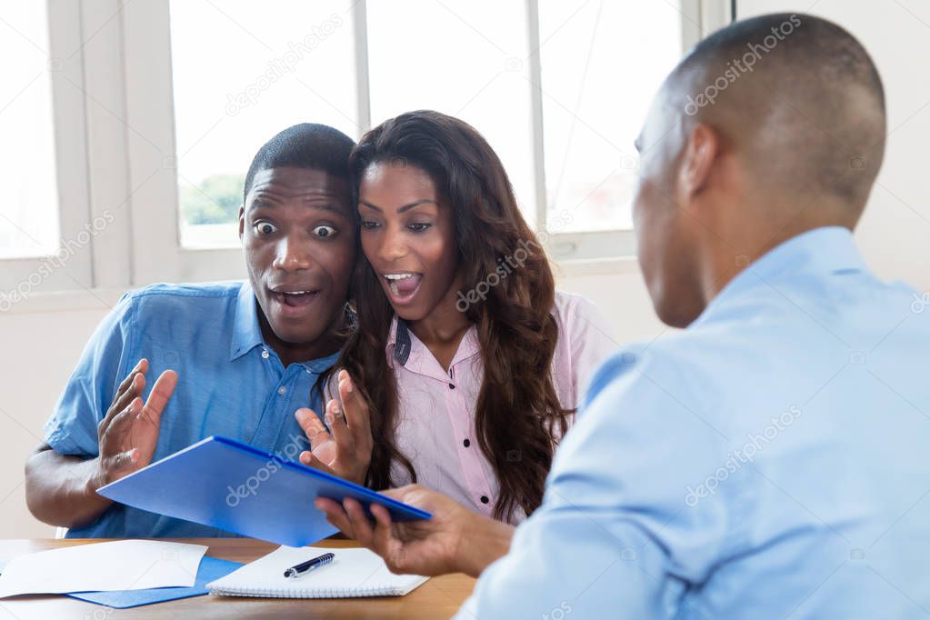 African american couple is happy about offer of agent