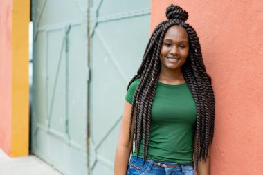 Beautiful african american young adult woman with amazing hairst