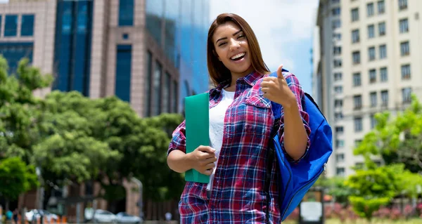 Successful hispanic female student in city — Stock Photo, Image