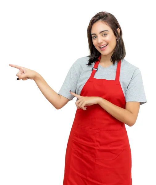 Pointing caucasian waitress with red apron — Stock Photo, Image