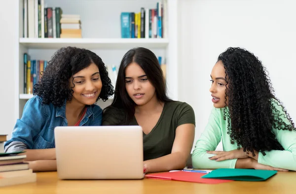 Group of latin american and arabic students learning at computer — Stock Photo, Image