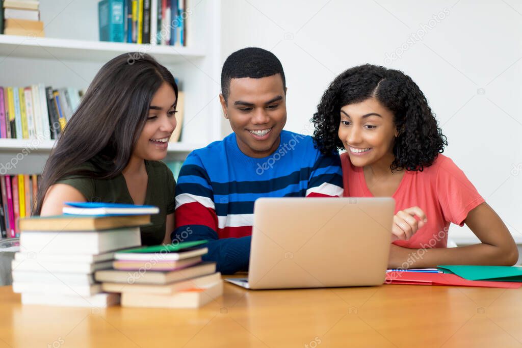 Group of laughing latin american computer programmer