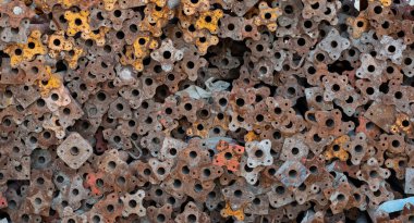 Background image of colorful scaffolding bar and wood used for construction stacked togeather