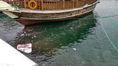Doha,Qatar- 01 November 2019: Garbage thrown in the water, water pollution.