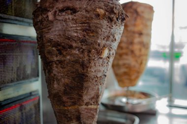 Background image with beef and chicken shawarma in a stand