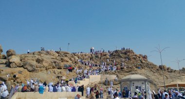 MECCA, SAUDI ARABIA - MARCH 29, 2019 The door of the Kaaba called Multazam at Grant holy mosque Al-Haram in Mecca Saudi Arabia. Muslim Pilgrims at The Kaaba in The Great Mosque of Mecca