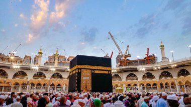 MECCA, SAUDI ARABIA - MARCH 29, 2019 The door of the Kaaba called Multazam at Grant holy mosque Al-Haram in Mecca Saudi Arabia. Muslim Pilgrims at The Kaaba in The Great Mosque of Mecca