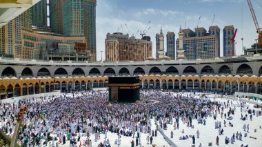 MECCA, SAUDI ARABIA - MARCH 29, 2019 The door of the Kaaba called Multazam at Grant holy mosque Al-Haram in Mecca Saudi Arabia. Muslim Pilgrims at The Kaaba in The Great Mosque of Mecca