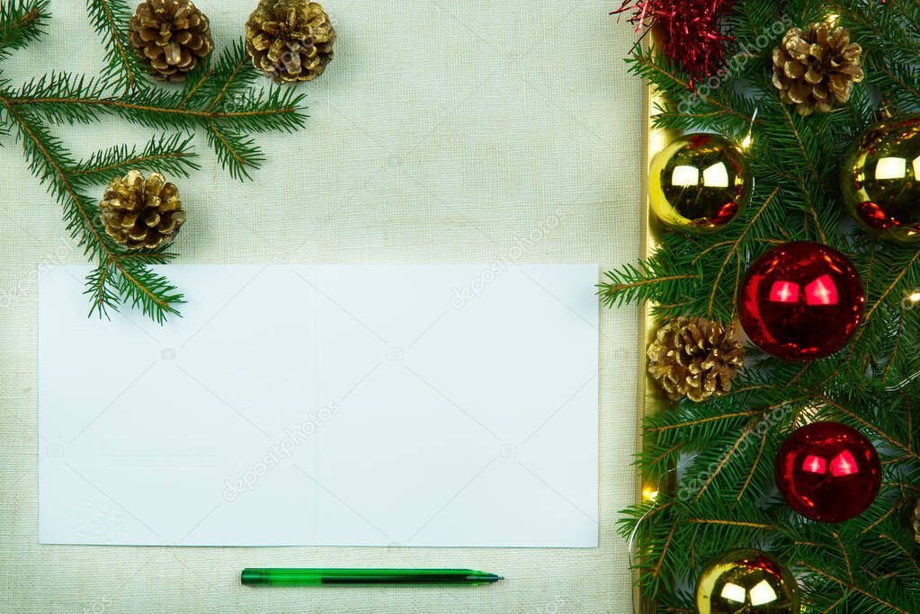 Christmas letter writing on a natural linen bedspread. Eco Christmas is always in fashion. Can be used as postcards, backgrounds, wallpapers, posters ... Christmas composition flat lay with Mockup.
