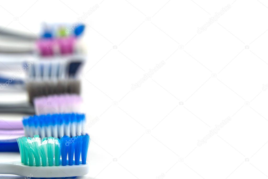 flat lay of toothbrushes on white background with copy space