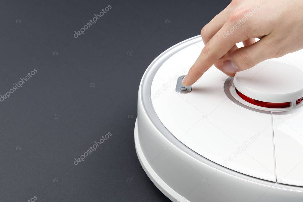 robot vacuum cleaner isolated on grey background, close up photo