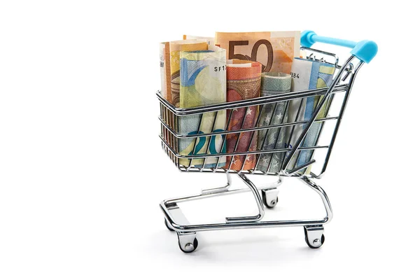 Closeup of a shopping cart full of euro banknotes isolated on white. concept: loan, investment, pension, saving money, financing, collateral, debt, mortgage, financial crisis or rise, rise or fall of — Stock Photo, Image