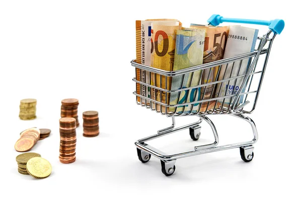 Shopping cart full of euro banknotes isolated on white. Concept: loan, investment, pension, saving money, financing, collateral, debt, mortgage, financial crisis or rise, rise or fall of shares — Stok fotoğraf