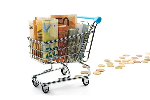 Shopping cart full of euro banknotes isolated on white. Concept: loan, investment, pension, saving money, financing, collateral, debt, mortgage, financial crisis or rise, rise or fall of shares — Stok fotoğraf