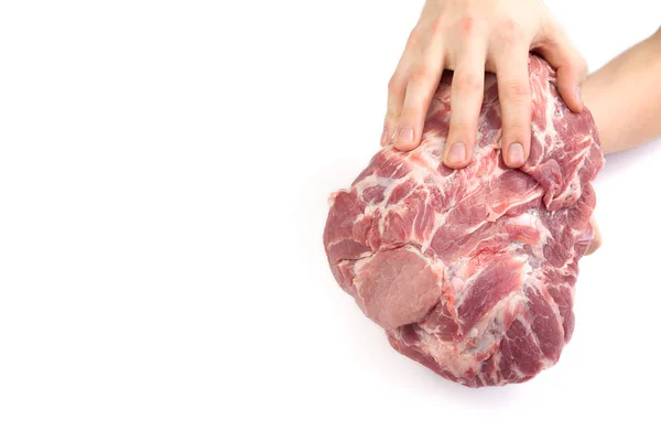 Hand houden groot stuk rauwe varkensnek, geïsoleerd op wit met kopieerruimte — Stockfoto
