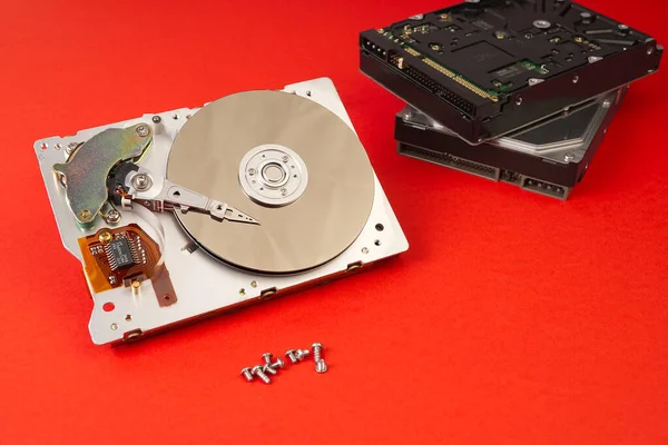 A hard disk drive HDD, hard disk, hard drive, or fixed disk is an electro-mechanical data storage device that uses magnetic storage to store and retrieve digital data using one or more rigid rapidly