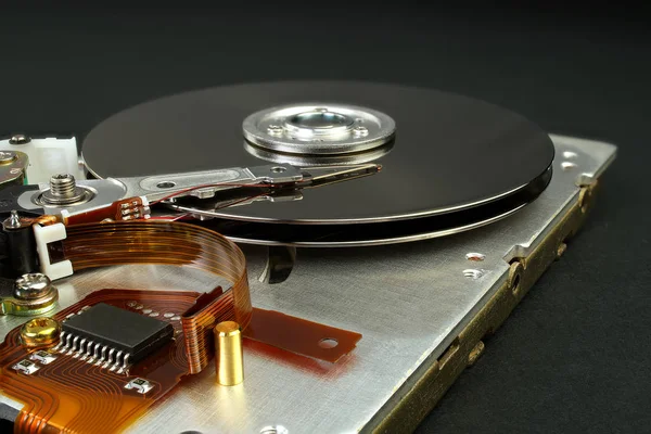 Detail of reading - writing head of hard drive. Close up inside of Hard disk drive - HDD . Hard disk for PCs, databases, banks, storage of personal data requires virus protection and timely Royalty Free Stock Images