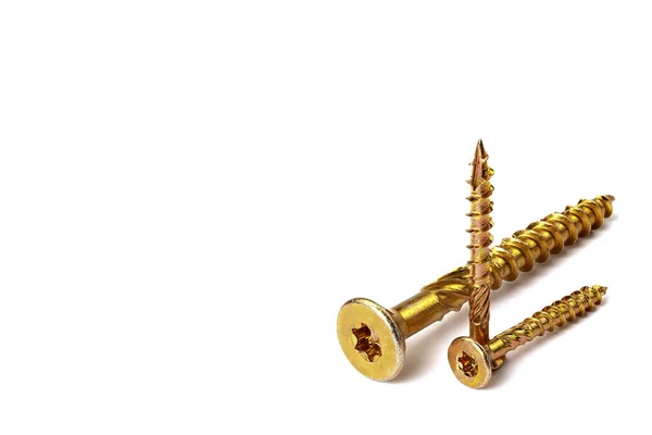 Gold torx screw isolated on white. Yellow zinc chipboard screw Torx, , full thread close up — Stock Fotó