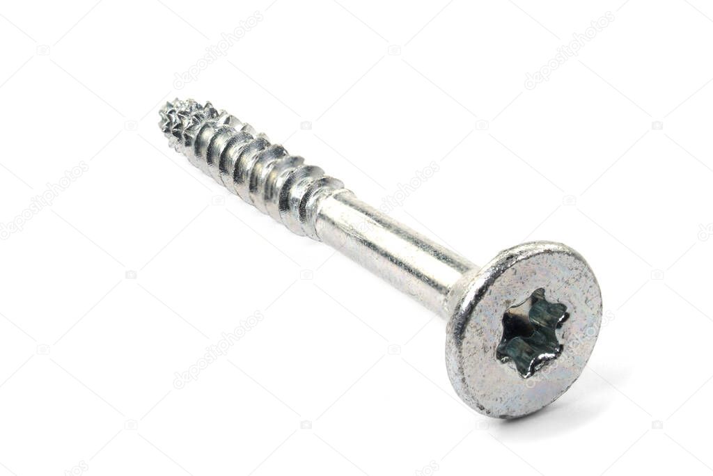 Torx screws on white background close up. Silver screws for wood, chipboard or plywood with torx head.