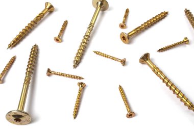 Gold torx screw isolated on white. Yellow zinc chipboard screw Torx, , full thread close up