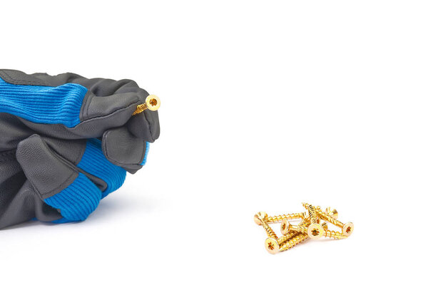 Men hand in glove holding yellow zinc torx screw, isolated on white