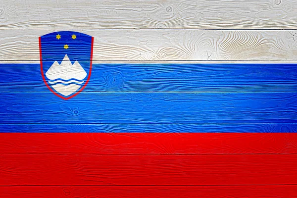 Slovenia flag painted on old wood plank background. Brushed natural light knotted wooden board texture. Wooden texture background flag of Slovenia.