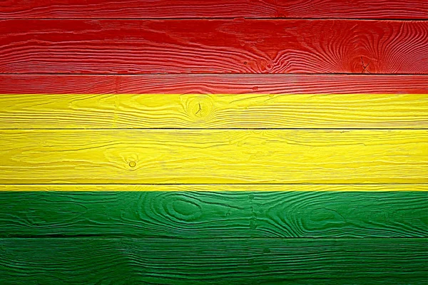 Bolivia flag painted on old wood plank background. Brushed natural light knotted wooden planks board texture. Wooden texture background flag of Bolivia