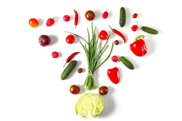 Colorful salad ingredients pattern made of cherry tomatoes, tomatoes, rosemary, cucumber, onion, chilli pepper, Garden radish and paprika on white background. Cooking concept.
