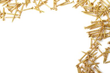 Gold screws scattered randomly on a white background. Torx yellow zinc head screws