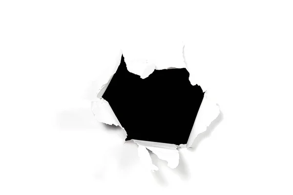 Beyaz kağıtta bir kara delik. Kırık beyaz kağıt. hiçliğe delik — Stok fotoğraf