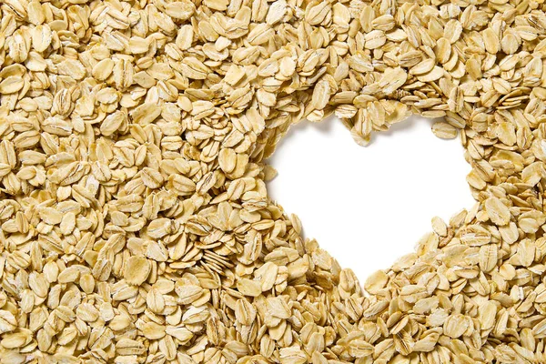 Close up of oats flakes. oats flakes macro shoot. Oatmeal flakes texture. Background of golden oat flakes. I Love Healthy food.