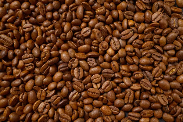 Textura de granos de café. Fondo de granos de café tostados. cerrar granos de café — Foto de Stock