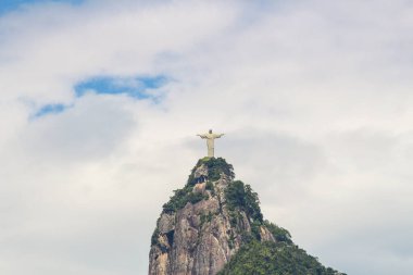 Image of Christ the Redeemer in Rio de Janeiro, Brazil - February 9, 2020: Christ the Redeemer with a beautiful blue sky with some clouds in the morning in Rio de Janeiro.