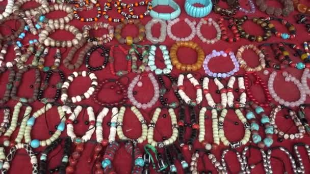 Close view of jewellery and bijouterie at Namche Bazaar street market, Pokhara, Nepal . — стоковое видео