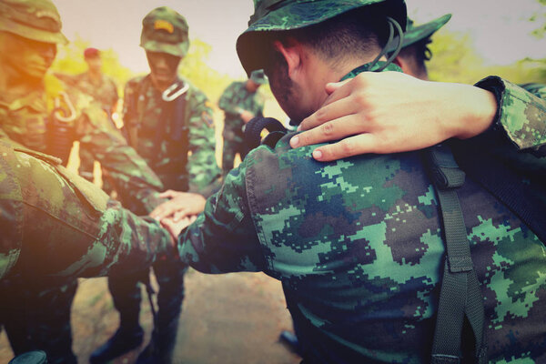 Teamwork Concept : Group of Soldier Hands Together Cross Process